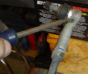 Front tie-rod end - wrench hold illustrated