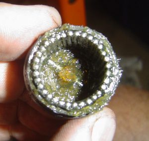 U-joint end cap close-up, fallen pin bearing