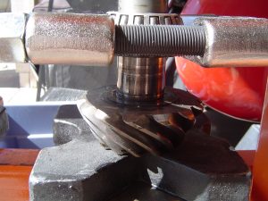 Bearing splitter removing bearing from pinion gear on Dana 36 differential