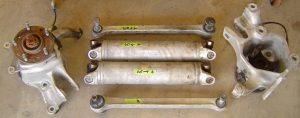 Disassembled rear axle shafts, camber rods, knuckles, C4 Corvette