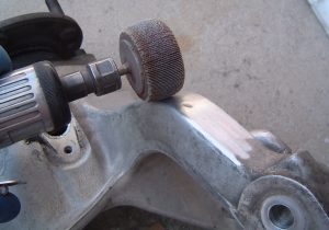 Die-grinder & flap wheel removing gouge from rear knuckle